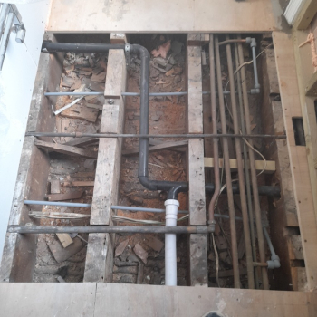 Tearing down the old bathroom.
