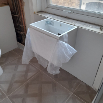 Installation of the toilet, the cabinet under the sink and the shower